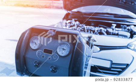 Car air conditioning ac repair service. Refill automobile ac compressor and checking auto conditioning system. Auto car conditioner diagnostic. Car air conditioning ac repair service. Refill automobile ac compressor and checking auto conditioning system. Auto car conditioner diagnostic. 92833877
