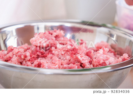 man mixes minced meat in bowl his hands man mixes minced meat in bowl his hands 92834036