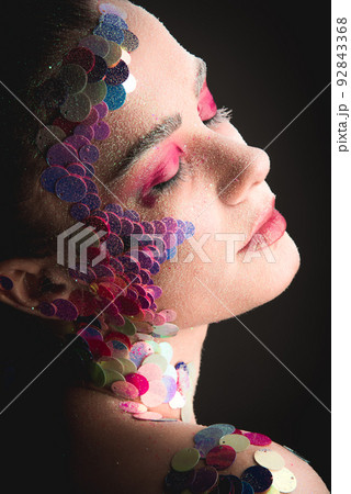 Portrait of a girl with colorful sequins makeup 92843368