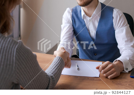 Closeup businessmen hands greet each other starting negotiations, handshake HR Closeup businessmen hands greet each other starting negotiations, handshake HR 92844127