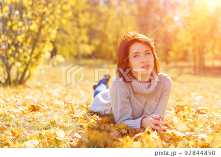 Young woman feels no problem as little girl concept. A lady in gray knitted 92844850