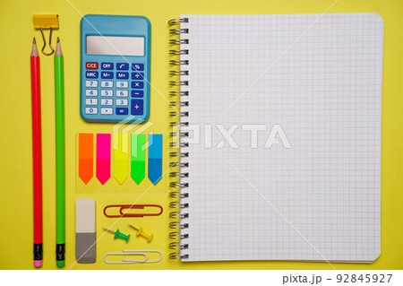 Notebook with a pen and colorful notes on a blue and orange background. Notebook with a pen and colorful notes on a blue and orange background. 92845927