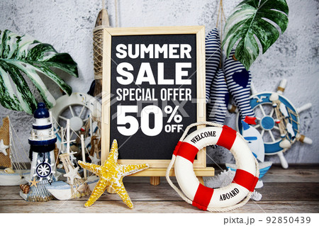 Summer sale text message decoration with nautical marine on wooden background Summer sale text message decoration with nautical marine on wooden background 92850439