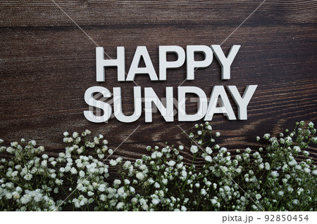 Happy Sunday alphabet letters with flowers on wooden background 92850454