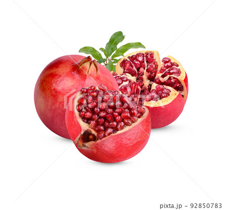 Fresh ripe pomegranate with leaves isolated on white background 92850783