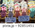 Scented candles as human bodies in a display case 92851451