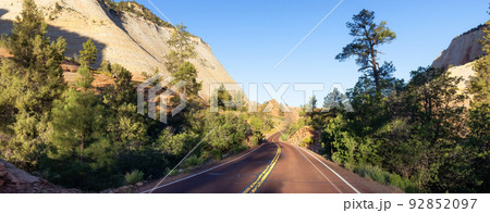 Scenic Road in American Mountain Landscape. Sunny Morning Sunrise Sky Scenic Road in American Mountain Landscape. Sunny Morning Sunrise Sky 92852097