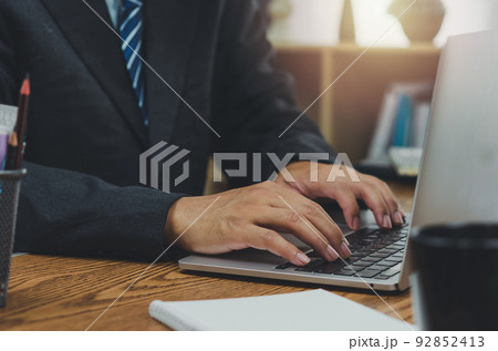 Business typing keyboard computer laptop technology online digital marketing and internet communication social network on table at office. 92852413