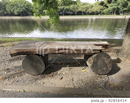 Old wooden bench or wooden chair in the park Old wooden bench or wooden chair in the park 92856414