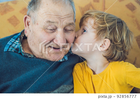 portrait of a Happy Boy Kissing Happy granddad portrait of a Happy Boy Kissing Happy granddad 92856777