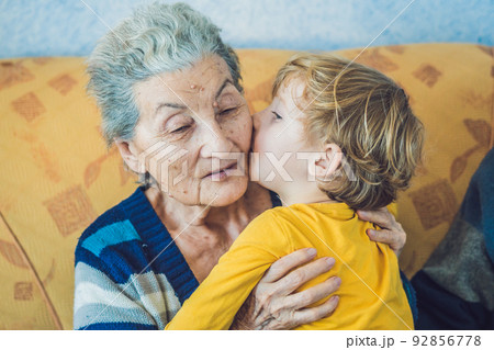 portrait of a Happy Boy Kissing Happy Grandmother portrait of a Happy Boy Kissing Happy Grandmother 92856778