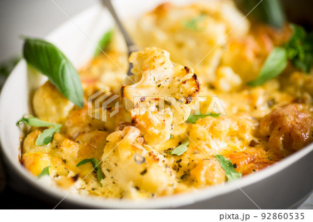 baked cauliflower with vegetables and cheese and scrambled eggs baked cauliflower with vegetables and cheese and scrambled eggs 92860535