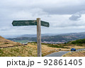 Empty wooden signpost in the mountains. Road sign on the mountain road without information on it 92861405