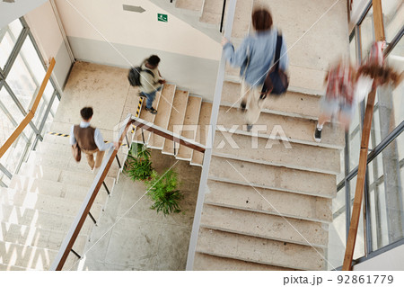Blurry motion of multicultural students of highschool on staircases 92861779