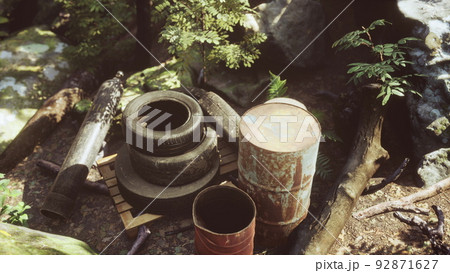 discarded car tires in the forest 92871627