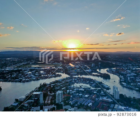 Aerial panorama view of High-rise building sky scrapers in Surfer Paradise beach and Pacific ocean landscape with Sunset light in the evening. Aerial panorama view of High-rise building sky scrapers in Surfer Paradise beach and Pacific ocean landscape with Sunset light in the evening. 92873016