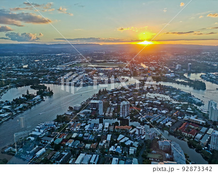 GOLD COAST, AUSTRALIA - APRIL 25, 2021 Aerial panorama view of High-rise building sky scrapers with inland canal and Surfer Paradise city skyline landscape with Sunset light in the evening. GOLD COAST, AUSTRALIA - APRIL 25, 2021 Aerial panorama view of High-rise building sky scrapers with inland canal and Surfer Paradise city skyline landscape with Sunset light in the evening. 92873342