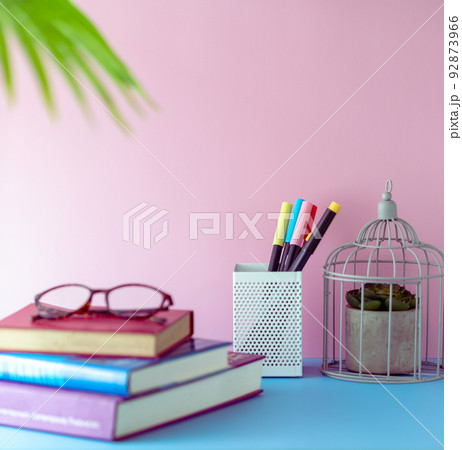 Back to school concept, Working or learning space design for student with blue tabletop and pink wall. Girly and feminine decoration style. 92873966