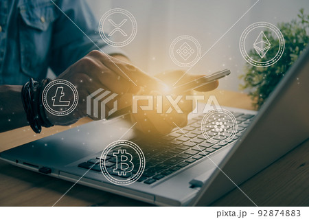 Casual Businessman Touching Mobile Phone Screen and Float Cryptocurrency Symbol in Vintage Tone 92874883