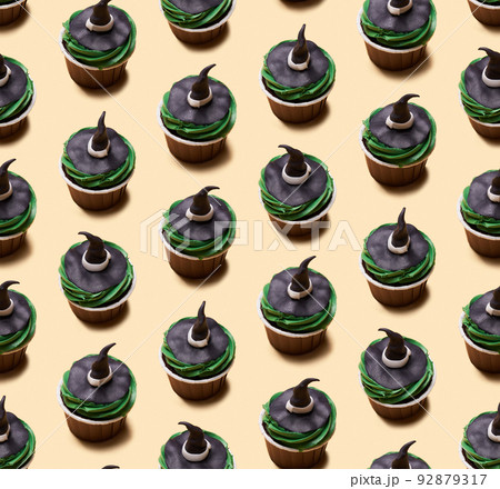Seamless pattern of Halloween treat maffin decorated witch hats. Seamless pattern of Halloween treat maffin decorated witch hats. 92879317