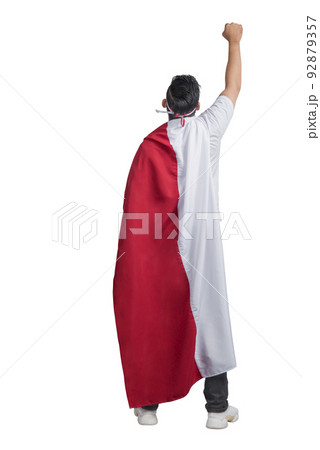 Rear view of Indonesian men celebrating Indonesian independence day on 17 August by wearing the Indonesian flag Rear view of Indonesian men celebrating Indonesian independence day on 17 August by wearing the Indonesian flag 92879357