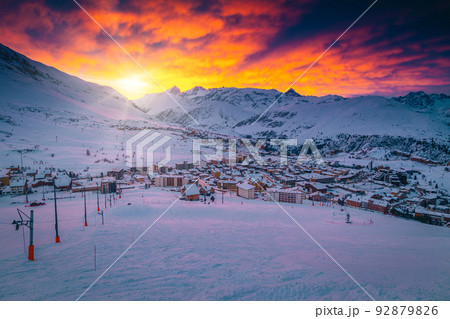 Colorful clouds over the ski resort at sunrise, France 92879826