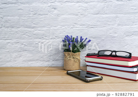 Office desk with supplies and wooden background. Copy space. 92882791