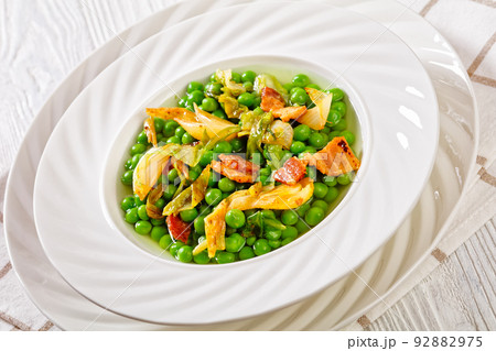 petits pois, french dish of garden green peas 92882975