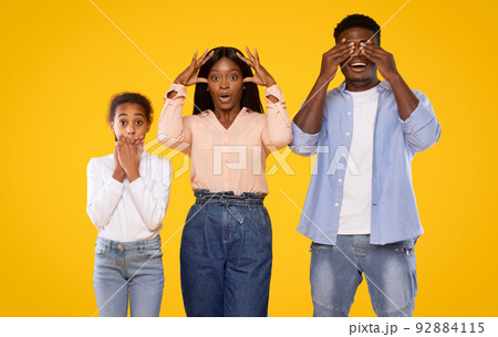 Hear no evil, see no evil, speak no evil. Black family of three people covering eyes, ears and mouth Hear no evil, see no evil, speak no evil. Black family of three people covering eyes, ears and mouth 92884115