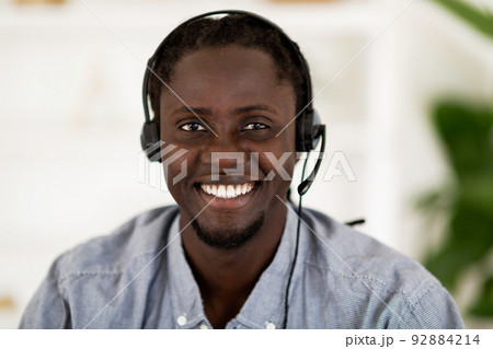 Call Center Worker. Closeup Portrait Of Black Male Hotline Manager In Headset Call Center Worker. Closeup Portrait Of Black Male Hotline Manager In Headset 92884214