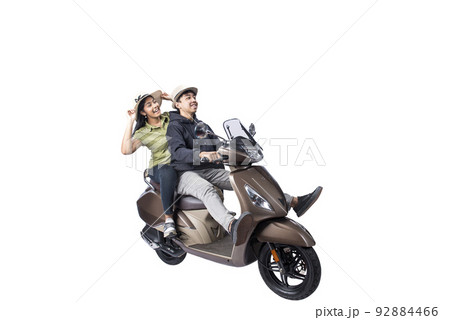 Asian couple with a hat sitting on a scooter 92884466