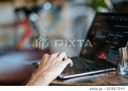 Woman working at home office hand on keyboard 92887044