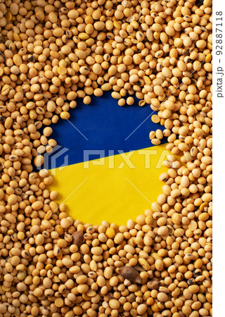 Burlap sack with soybeans and Ukrainian flag concept Burlap sack with soybeans and Ukrainian flag concept 92887118
