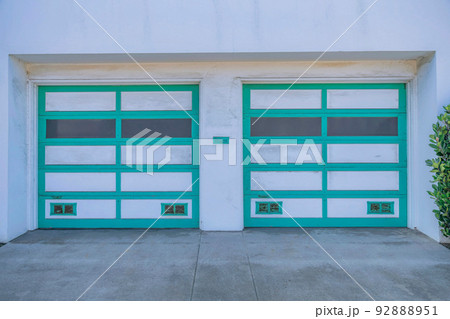 Two sectional garage doors with green trims in San Francisco, California Two sectional garage doors with green trims in San Francisco, California 92888951