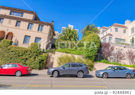 Dutch angle shot of a neighborhood with tilted houses in San Francisco, CA 92888961