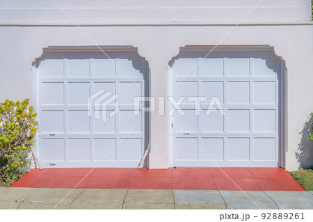 Two white sectional garage doors with clipped entrance- San Francisco, California Two white sectional garage doors with clipped entrance- San Francisco, California 92889261