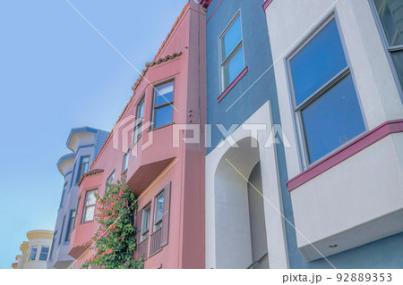 Low angle view of colorful row of houses in San Francisco, CA 92889353