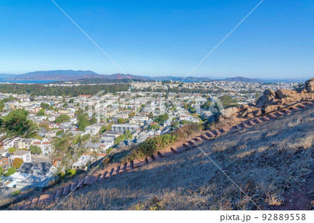 Stairs hiking trail with overlooking view of dense residential buildings at San Francisco, CA 92889558