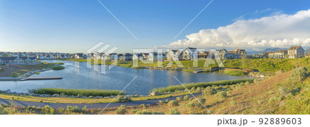 Residential houses surrounding the Oquirrh Lake at Daybreak, South Jordan, Utah 92889603