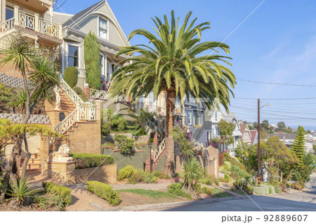 Neighborhood in San Francisco, California with stairs and staues at the front Neighborhood in San Francisco, California with stairs and staues at the front 92889607