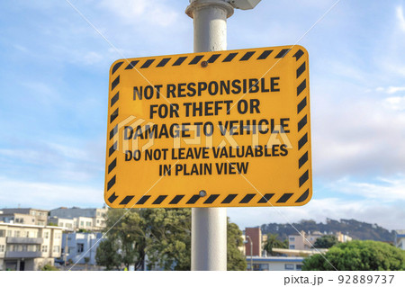 Yellow warning sign on a post in San Francisco, California Yellow warning sign on a post in San Francisco, California 92889737