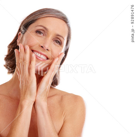 My skin still feels great. Studio portrait of a beautiful mature woman posing against a white background. My skin still feels great. Studio portrait of a beautiful mature woman posing against a white background. 92891476