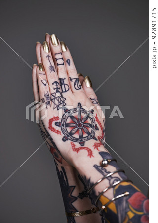 Creative self-expression. A cropped shot of tattooed hands. 92891715