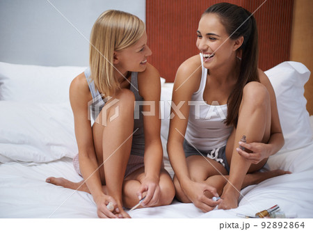 I love sleepovers with my best friend. Two young women pampering themselves at a sleepover. I love sleepovers with my best friend. Two young women pampering themselves at a sleepover. 92892864