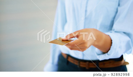 I have to buy that. Shot of someone giving a credit card to make a purchase. 92892998
