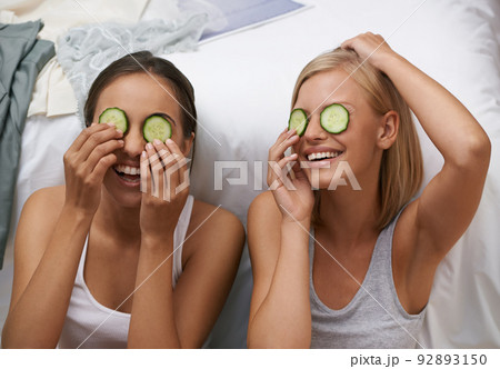 Beauty routines are always fun with my best friend. Two young women pampering themselves at a sleepover. Beauty routines are always fun with my best friend. Two young women pampering themselves at a sleepover. 92893150
