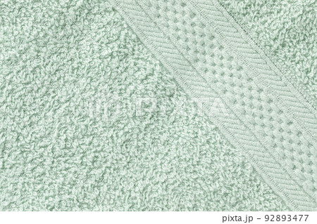 Mint green bath sheet or towels texture pattern background. Bathroom body hygiene or spa concept. Close up, copy space Mint green bath sheet or towels texture pattern background. Bathroom body hygiene or spa concept. Close up, copy space 92893477