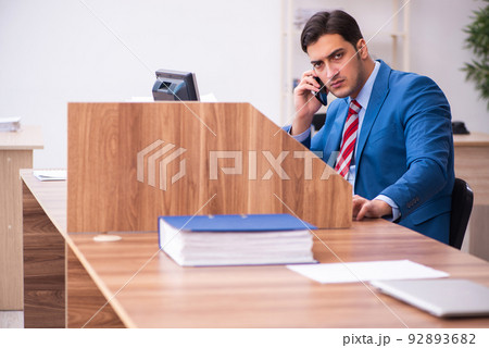Young businessman employee working in the office Young businessman employee working in the office 92893682