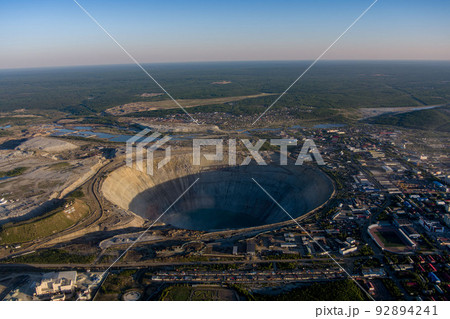 Kimberlite pipe Mir. indigenous diamond deposits. On the way to the bottom of the spiral 8 kilometers. Diameter 1200 meters depth of 525 meters. Yakutia, northern Russia. Kimberlite pipe Mir. indigenous diamond deposits. On the way to the bottom of the spiral 8 kilometers. Diameter 1200 meters depth of 525 meters. Yakutia, northern Russia. 92894241