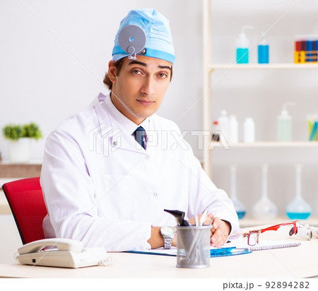Young male doctor otolaryngologist working at the hospital 92894282